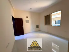 Spacious studio for annual rent in Al Alia, Ajman, with a separate kitchen and central A/C, near She