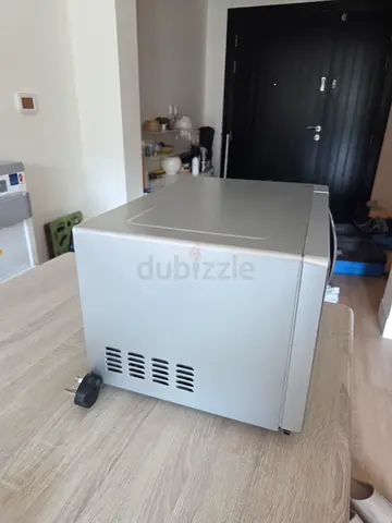 Compact black and decker microwave. Works perfectly. Few scratches
