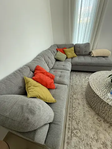 Comfortable L-shaped Grey Fabric Sofa - Good Condition