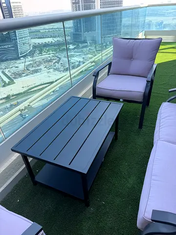 Outdoor patio lounge chair set with coffee table and cushions
