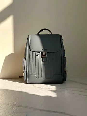 Rimowa Minimalist gray leather-look backpack — lightly used
