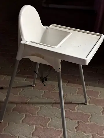 Simple white baby high chair — metal legs
