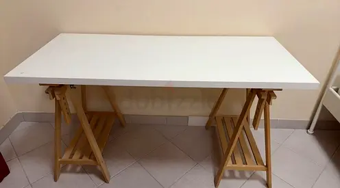 Simple white rectangular desk with wooden trestle legs