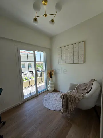 Grey arm chair and Light beige round rug — gently used, perfect for cozy corner.