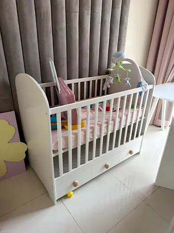 IKEA baby crib with under-drawer storage