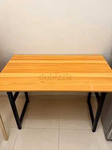 Simple wooden study table with metal legs