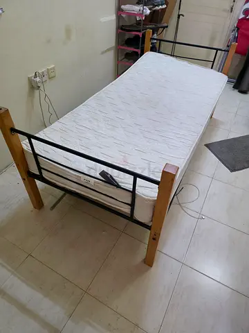 Single wooden bed frame with mattress - simple metal slats