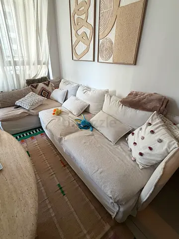 Light beige L-shaped fabric sofa, comfy sectional with cushions