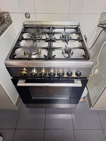 Used stainless steel 4-burner gas cooker with oven - good working condition , italian made