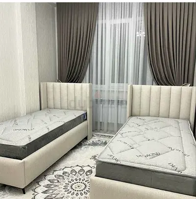 Matching Single Twin Beds with Vertical Tufted Headboards