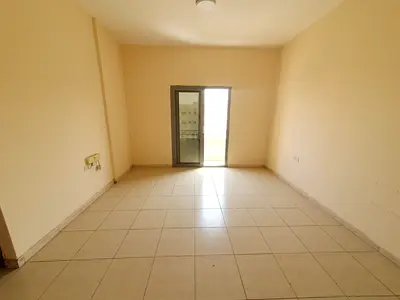 AMAZING 1BHK WITH BALCONY ON ROAD BUILDING IN MUWAILEH