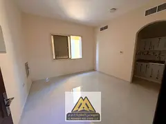 Spacious studio for annual rent in Al Alia, Ajman. Separate kitchen, central AC, prime location near