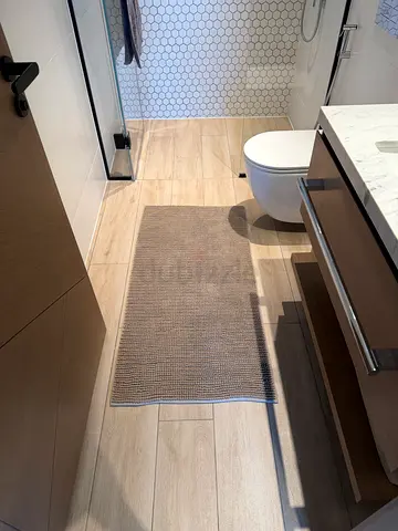Beige bathroom runner rug
