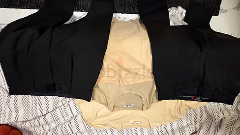 Bundle of men's trousers and t-shirts, sneakers