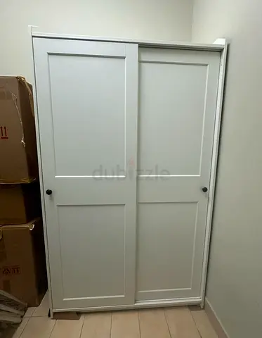IKEA HAUGA Wardrobe with Sliding Doors – AED 400