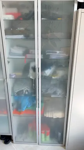 Tall frosted glass double-door storage cabinet - good condition