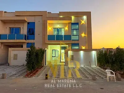 Villa for sale in Al Helio, Ajman—registration fees included. Features 5 master bedrooms, a majlis, a living area, and a maid's room. Freehold ownersh