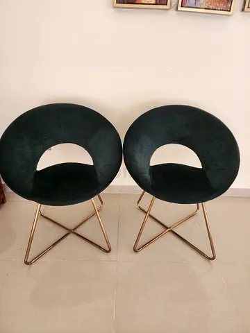 Pair of modern round velvet dining chairs with gold legs