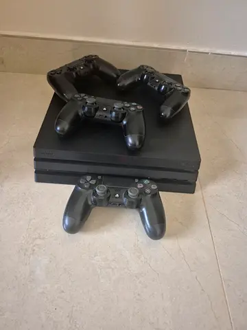 Sony PlayStation 4 Pro with 4 DualShock 4 Controllers - Good Condition