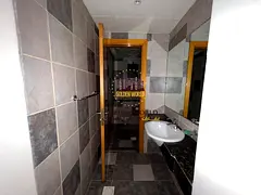 2BR apartment in Al Majaz 2 with free AC and parking. Prime location near services. Annual rent AED