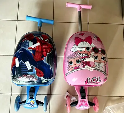 Pair of Kids Ride-On Suitcase Scooters — Spiderman & LOL Surprise