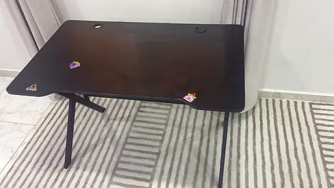 Black glass top study/office table with cable holes - good condition