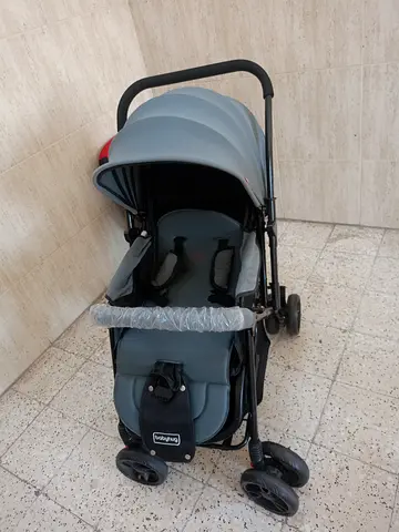 Lightweight grey baby stroller with canopy and storage (used)