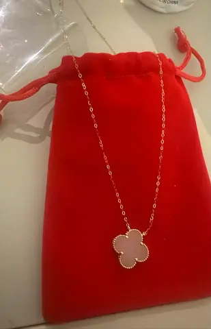 Delicate gold-tone clover pendant necklace with mother-of-pearl inlay