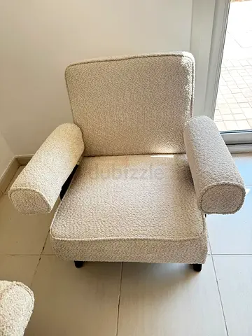 Cozy boucle upholstered armchair with removable bolster cushions