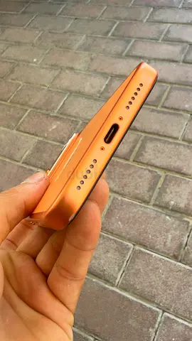 iPhone (orange/coral) - good working condition, single SIM