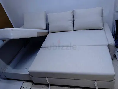 Light grey convertible sofa bed with storage - good condition
