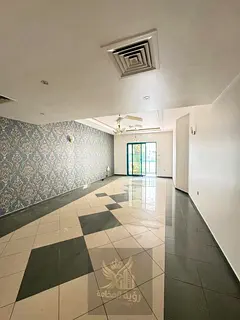 For Annual Rent in Al Majaz 3 Spacious three-bedroom apartment with a living room and two balconies,