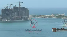 2BR + Hall in Al Majaz 2 with Free Parking & Balcony. Prime vibrant location near all services & Dub