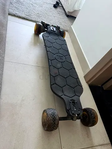 Used electric longboard skateboard with large off-road wheels Wowgo charger with remote very good