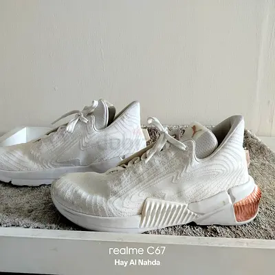 pair of white Puma Provoke XT Future 'White Rose Gold' training sneakers (price negotiable)