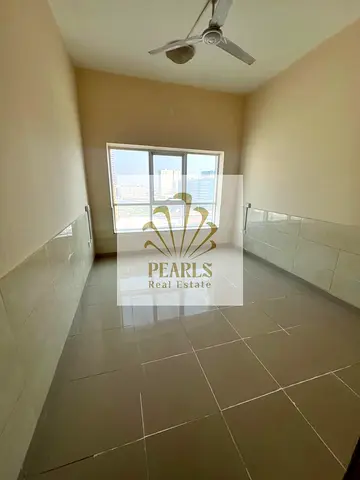 Great opportunity in Al Rashidiya 1 – Pearl Towers! 2BR + living room, 2 baths, 2 balconies, open city view, private parking, kids’ play area, garden