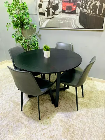 Black round dining table with 4 matching chairs - modern set