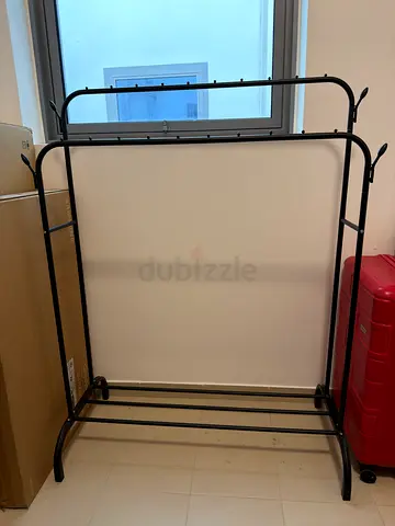 Black metal freestanding clothes rack
