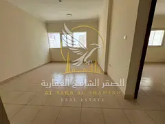 New building: one-bedroom apartment with a living room in Al-Qulai'a. Features an open view, sandy p