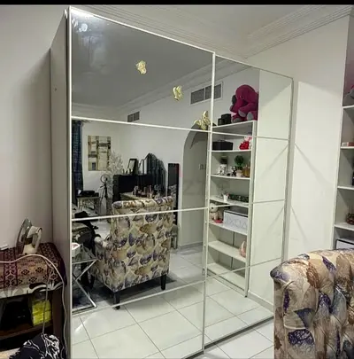 Large mirrored sliding-door wardrobe in good condition