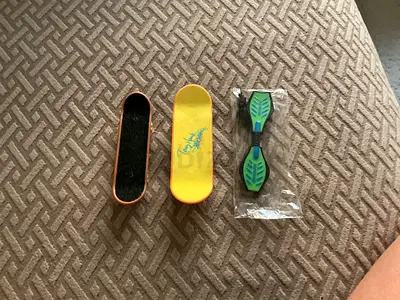 Mini fingerboards and a caster board wheel toy - preowned set