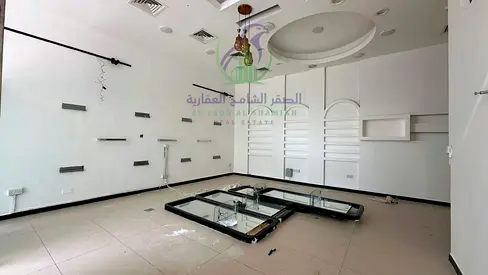 Commercial shop available for rent in Al Taawun with a total area of 750 square feet, located directly on the main road.