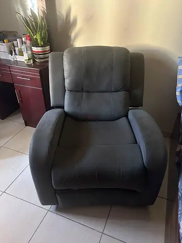 Single grey fabric recliner armchair in good condition