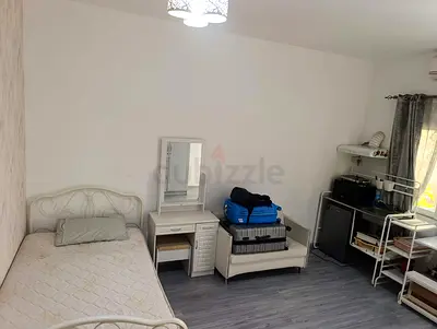 Room available for working ladies in private villa al wasl behind box park.