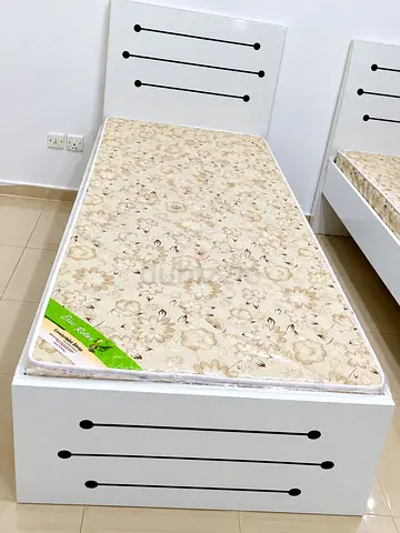 Brand new single wood Bed including mattress available
