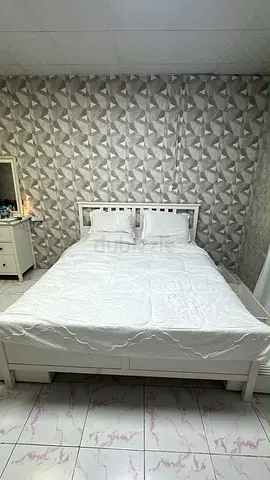 White wooden double bed with storage - good condition