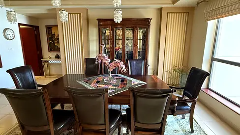 Solid Wood Dining Table with 8 Leather Chairs and Display Cabinet
