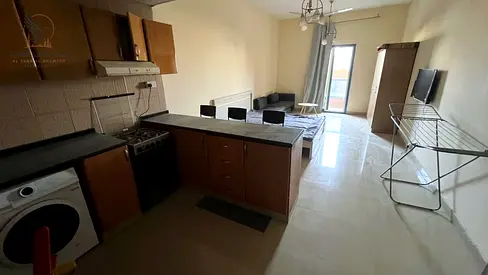 Furnished studio for annual rent, featuring a private parking space and a balcony; located next to