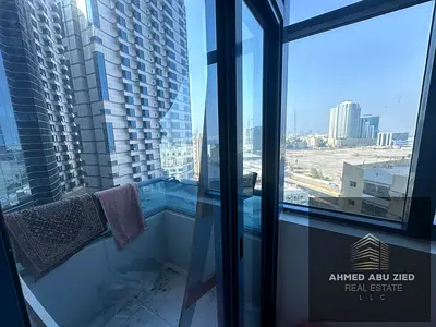 Two bedrooms and a living room for annual rent in Ajman, Falcon Towers. Prime location. Excellent size. Central air conditioning with a balcony. Price