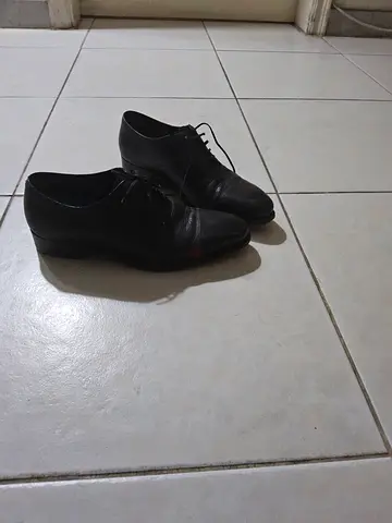 Men's black leather dress shoes - size not specified, gently used